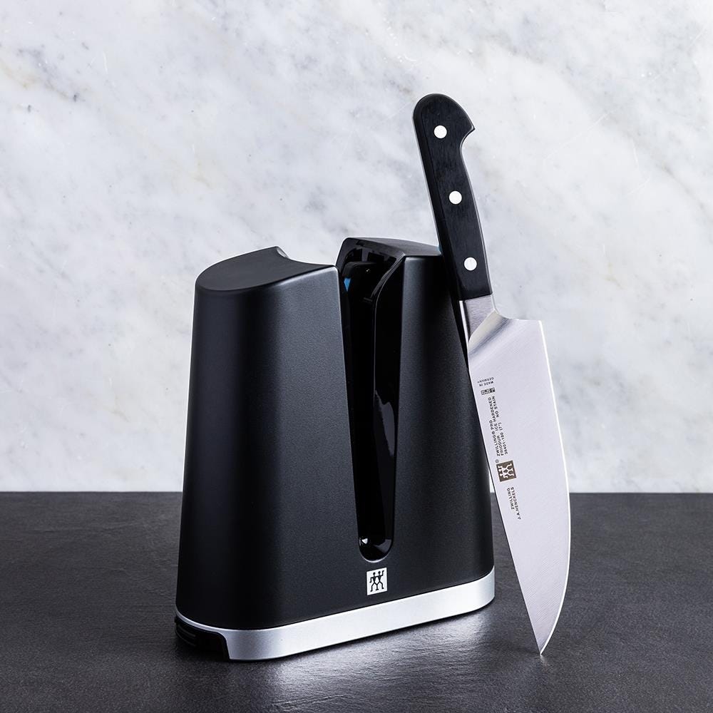 https://www.nellaonline.com/cdn/shop/products/1262_Zwilling__Pro_Chef_Knife_with_V_Edge_Sharpener_1024x1024.jpg?v=1606339114